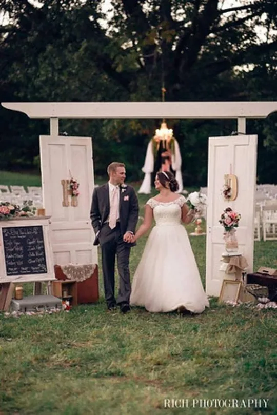 The Wooded White Arbor with its mounted wooden doors beneath the trees in the Smoky foothills